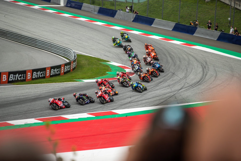 The field right after the start going into curve 1 at Red Bull Ring - MotoGP 2021
